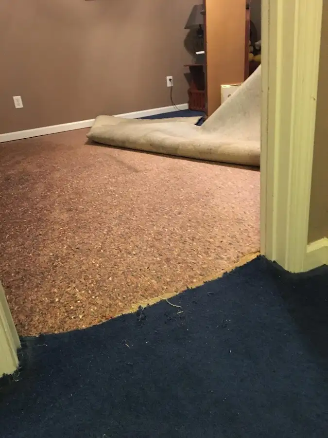Carpet pad removal revealing water damage during Drying & Dehumidification in Thousand Oaks